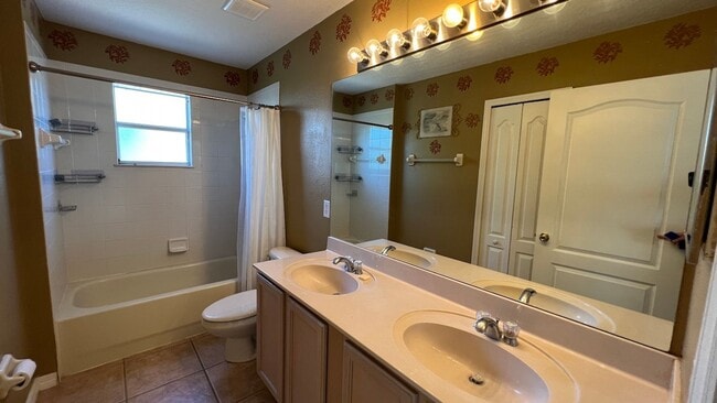 Building Photo - Spacious 4/3.5 Pool Home with Water View & 3-Car Garage in Lee Vista Area (close to Lake Nona)
