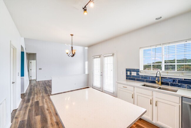 Building Photo - Enjoy Riverfront Living! Spacious 4-Bedroo...