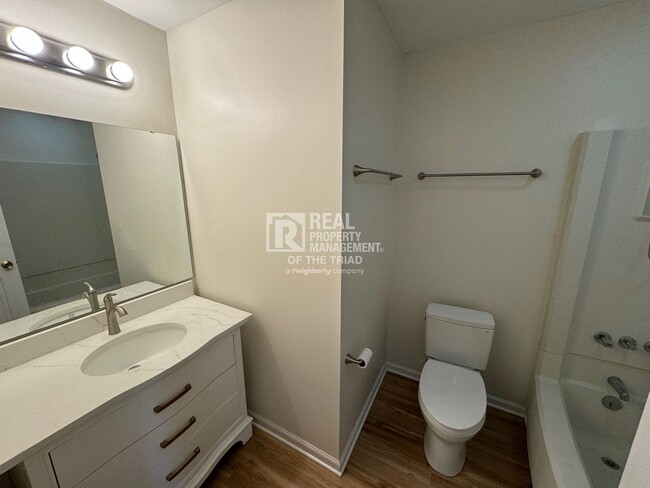 Building Photo - MOVE IN SPECIAL! One Level End Unit Townho...