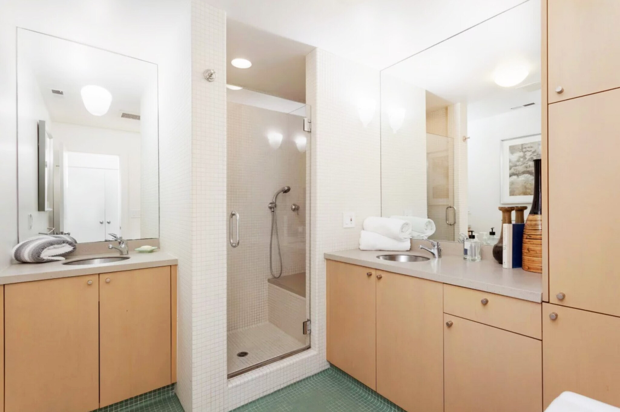 Downstairs bathroom has large tiled spa shower with both overhead shower head and 2 sinks & vanities - 328 Harriet St