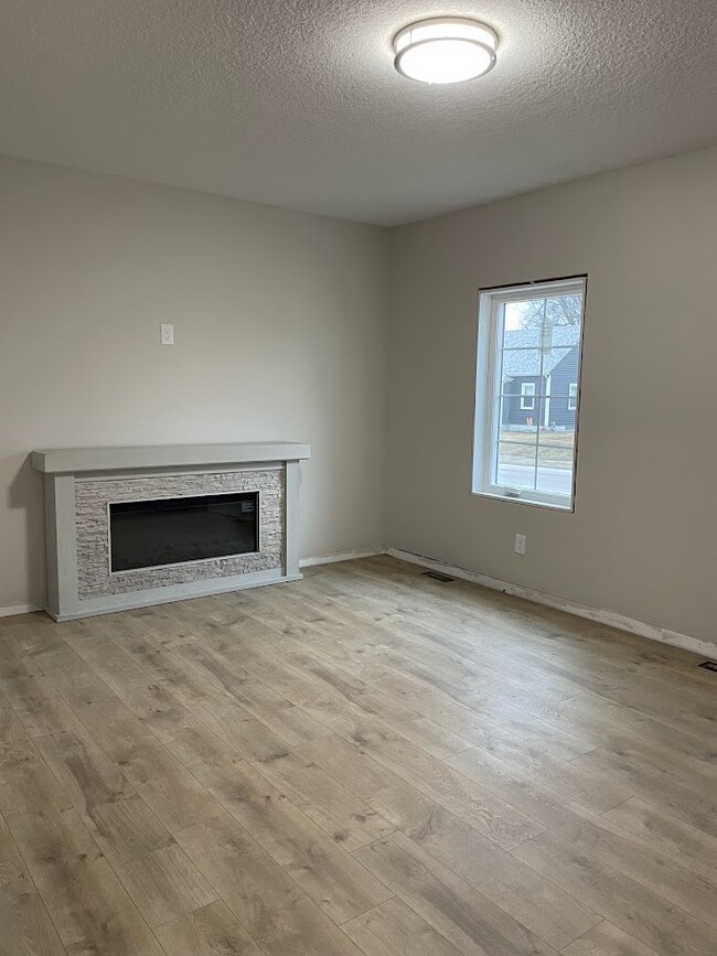 Living room with Electric Fireplace - 2623 College Ave