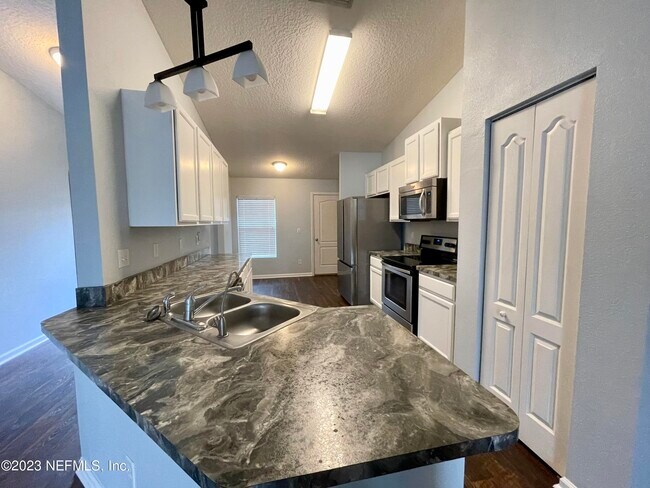 Building Photo - 15319 Bareback Dr