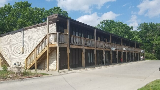 Building Photo - Large Studio Apartments set back in quiet ...