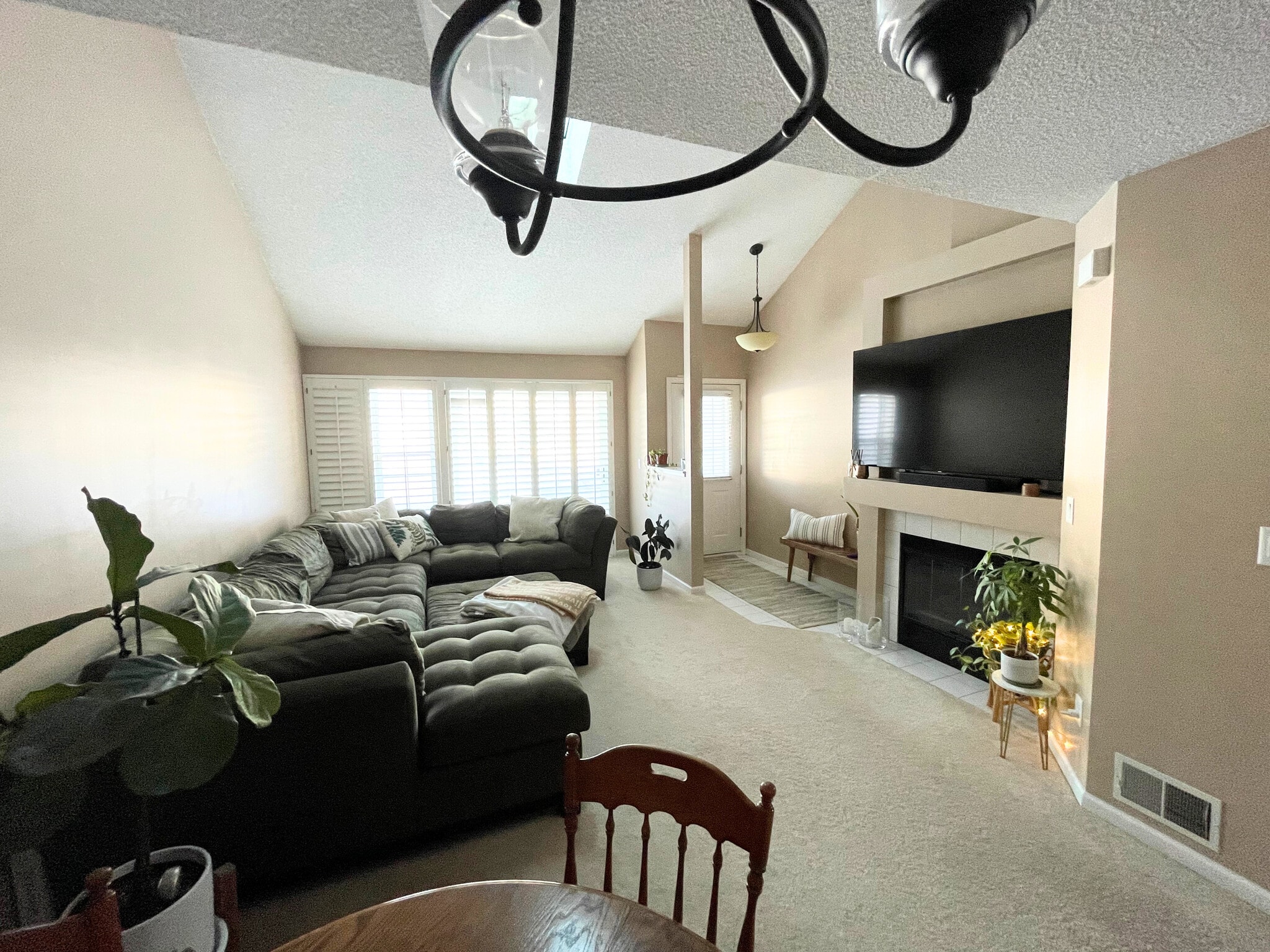 Living room with gas fireplace overlooking the front patio. - 15805 24th Ave N.