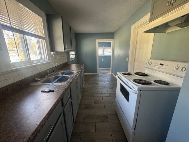 Building Photo - Charming 3BR 2BA Home w/ Fenced Yard + Covered Porch in KC