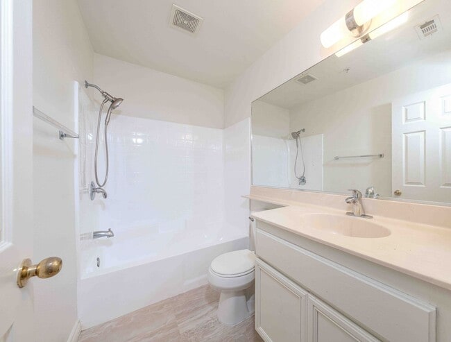 Building Photo - Gated Townhome with Updated Kitchen and Private Backyard