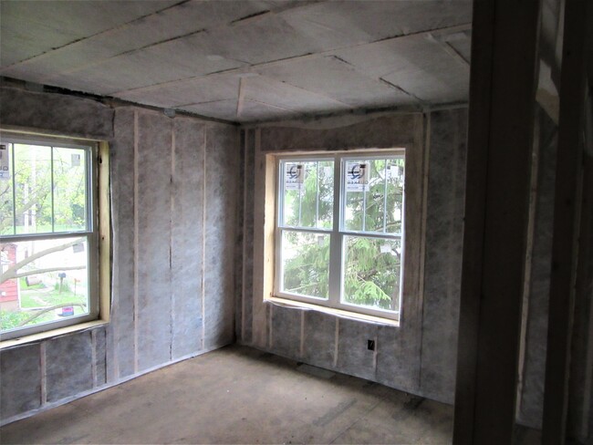 walls and ceiling netted and blown full of cellulose insulation - 409 W Maple St