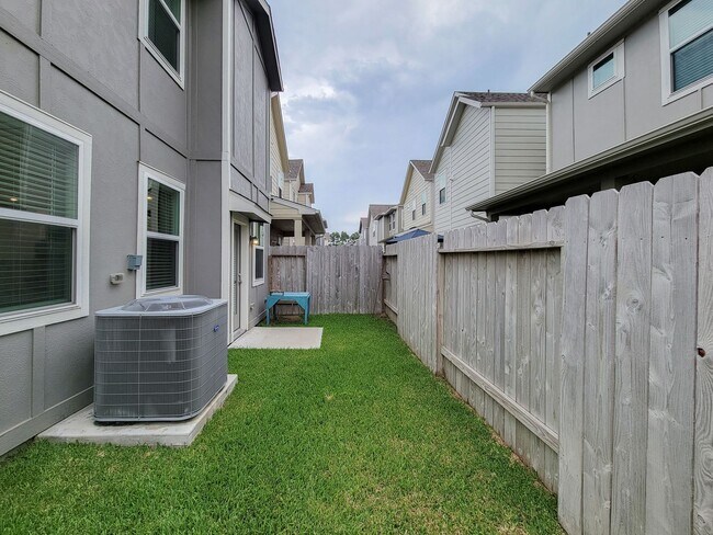 Building Photo - A true gem on a quiet corner lot, this spacious and sun-filled home is tucked away from street no...