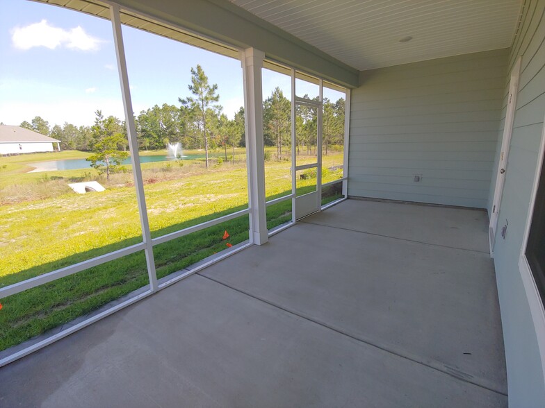 Screened in porch - view of retention pond - 133 Stonegate Drive