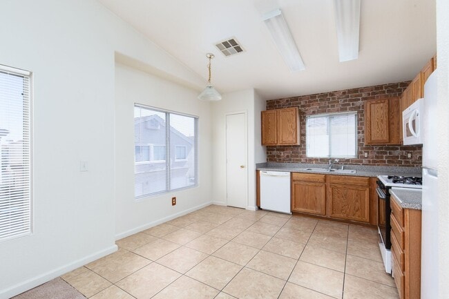 Building Photo - Two bedroom townhome with garage in gated ...