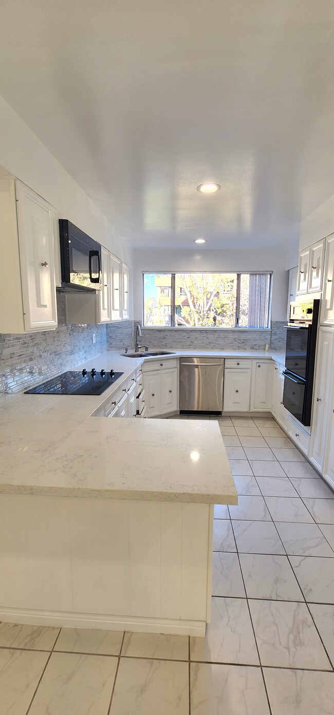 Kitchen with New Quartz Countertops - 303 N Swall Dr
