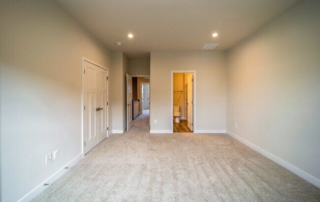 Building Photo - This 3-bedroom, 3-full bathroom townhouse offers a pristine and contemporary living experience.