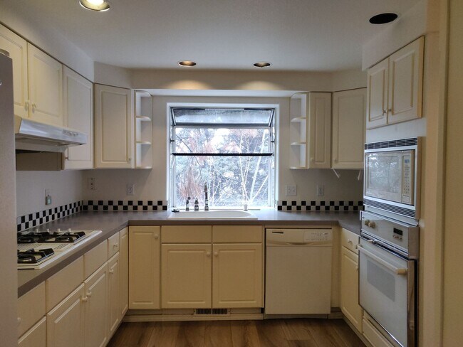 Building Photo - Spacious and charming, this two-story 4 be...