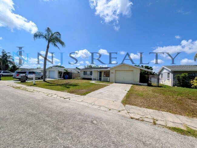 Building Photo - Gorgeous 3/2/1 1200 Sq. Ft. with fenced yard, all tile floors, custom baths and remodeled kitchen!!