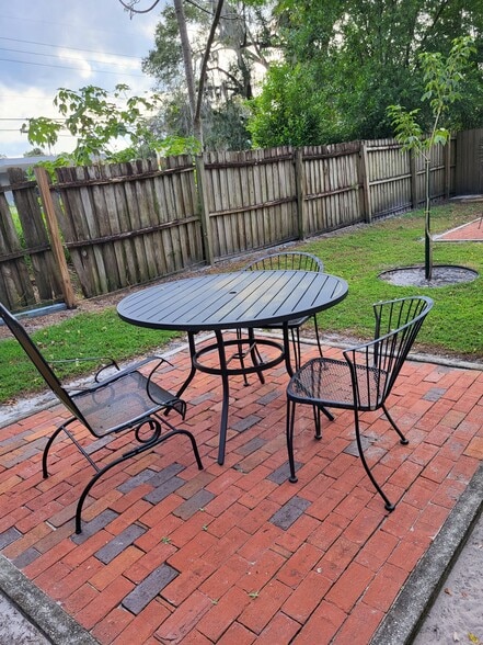 1210's brick patio pad with table and chairs - 1210 E Jackson St