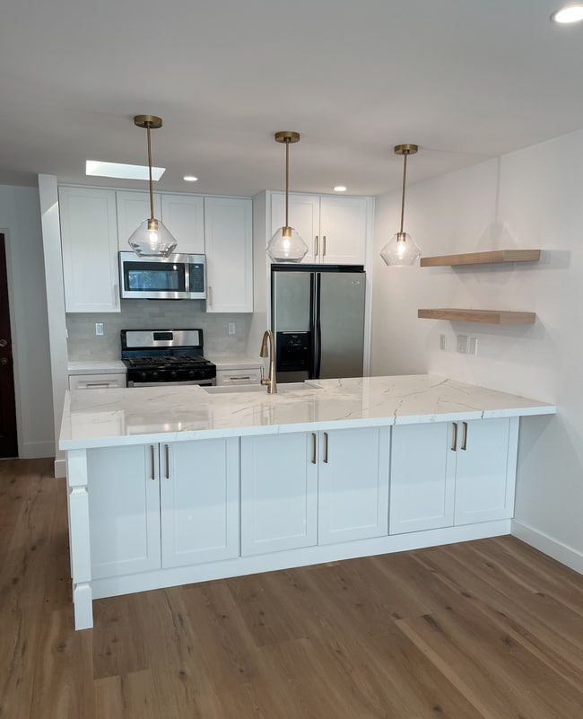 9 foot island with white oak floating shelves, quartz countertops, apron sink and designer hardware - 1741 Granville Ave