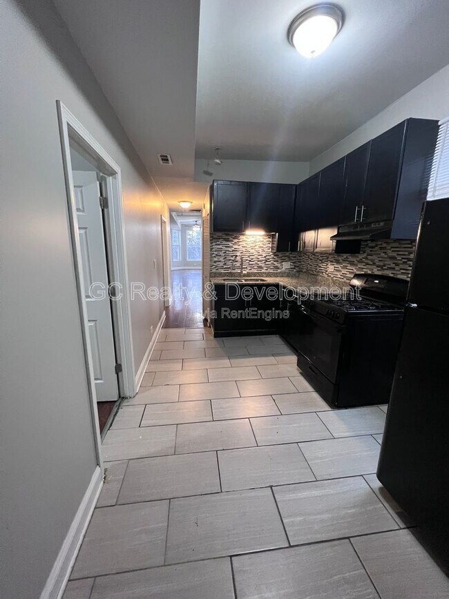 Building Photo - 7644 S Normal Ave