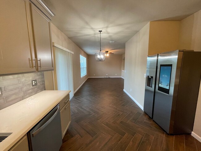 Building Photo - BEAUTIFUL 3 BEDROOM 2.5 BATH FEATURING A LUXURY KITCHEN WITH WHITE GRANITE COUNTERS, GRAY CABINET...