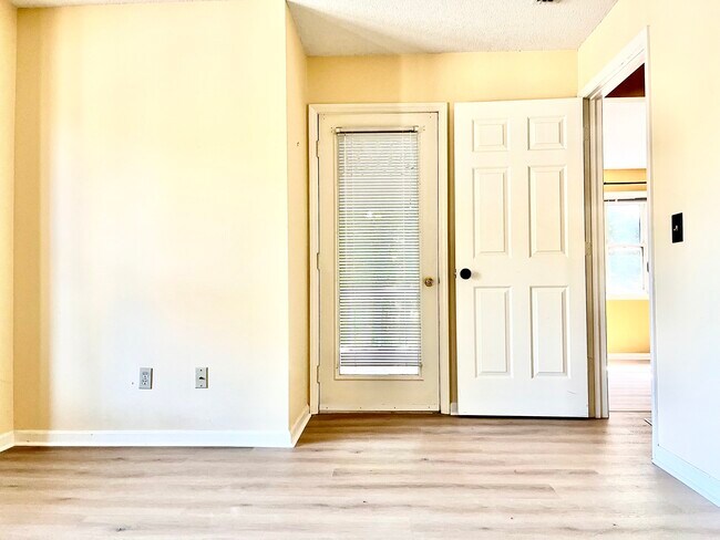 elevated primary bedroom has new flr - 245 Oakwood Ct