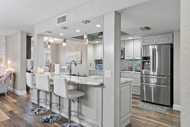 Building Photo - Two Bedroom/Two and a half bath gated townhome.