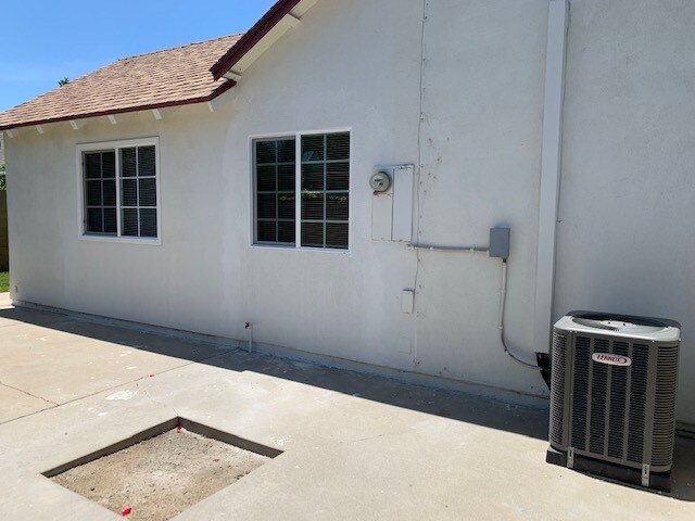 East side view- AC system - 12952 Andy Dr