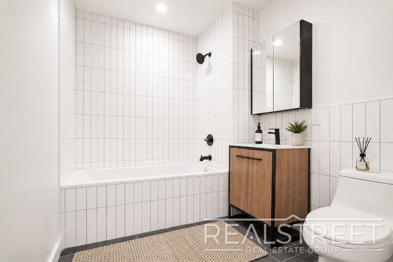 Building Photo - Sun-Filled Penthouse Duplex with Massive Private Terrace & Bonus Storage Room