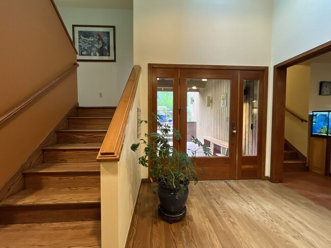 Building Photo - One-of-a-Kind Custom Home with Wall of Windows, Stone Fireplaces, Expansive Entertainment Space &...