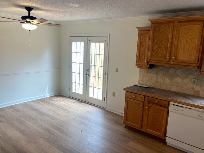 French doors to the deck invite you to spend mornings and evenings with sunlight. - 7005 Sand Wedge Cir