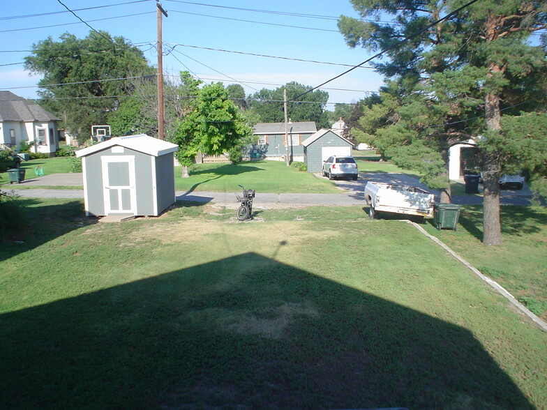 Parking where bicycle is parked. White trailer for all bagged trash. - 714 Main St