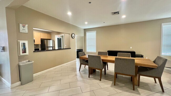 Building Photo - Top Floor Sweet and Spacious studio with resort style amenities and In-Unit Washer & Dryer!