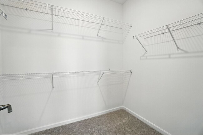 Building Photo - Brand-new three-story townhome in the Univ...