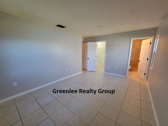 Building Photo - Relax by the water in this spacious 2-bedroom home with a 2-car garage, nestled in the highly des...