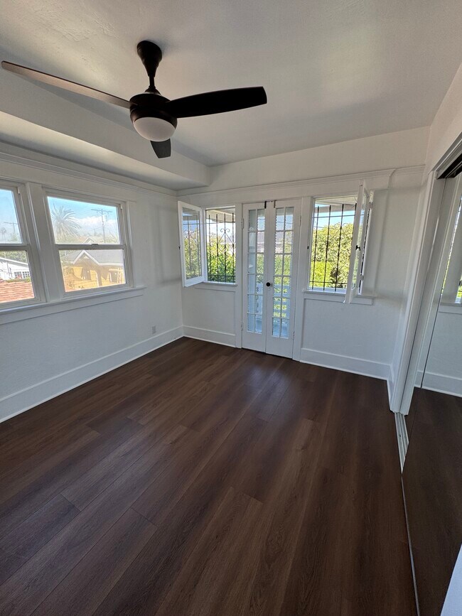 Large Bedroom with private patio that looks out over the backyard - 2030 6th Ave