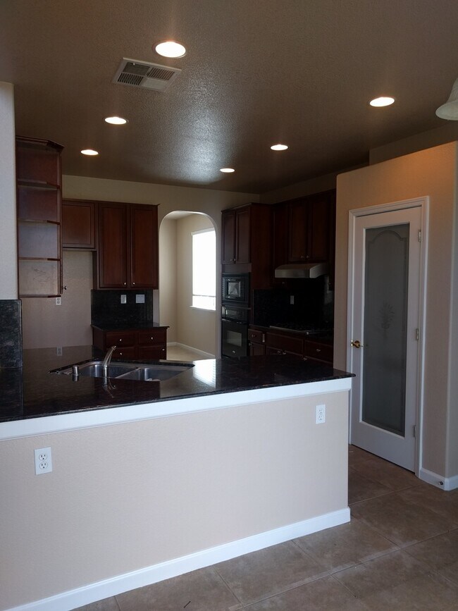 Building Photo - Gated Community Stunner ready to be called...