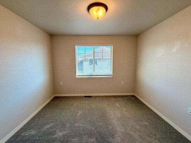 Building Photo - Move-In Ready 3-Story Townhome with Loft & 2-Car Garage