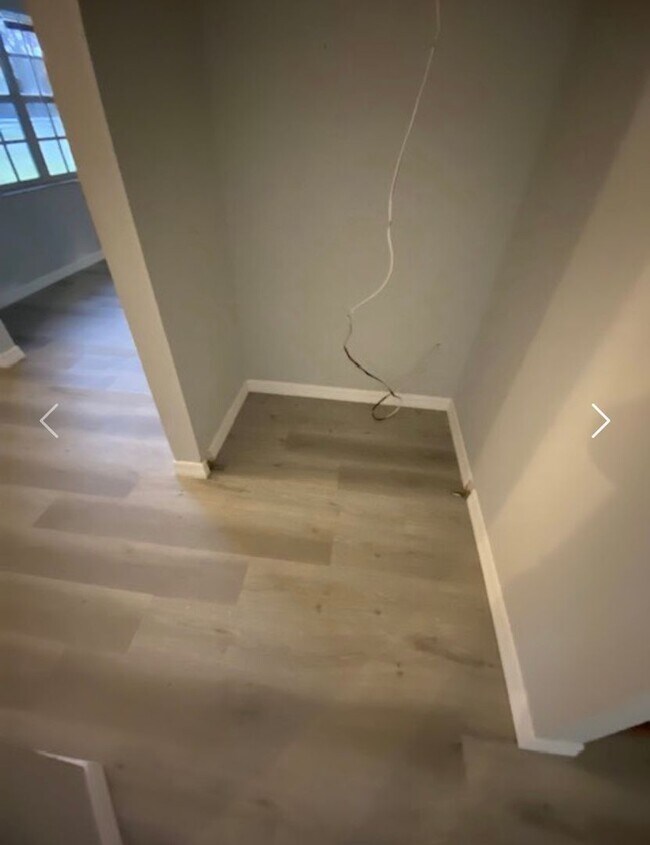 Building Photo - Available NOW! NEW FLOORS AND PAINT! Lovely 3/2 in Poinciana! HUGE fenced yard and NO CARPET!