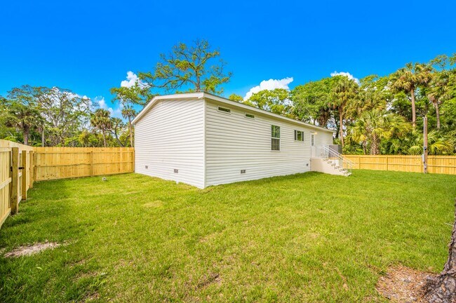 Building Photo - Experience exceptional living at its finest