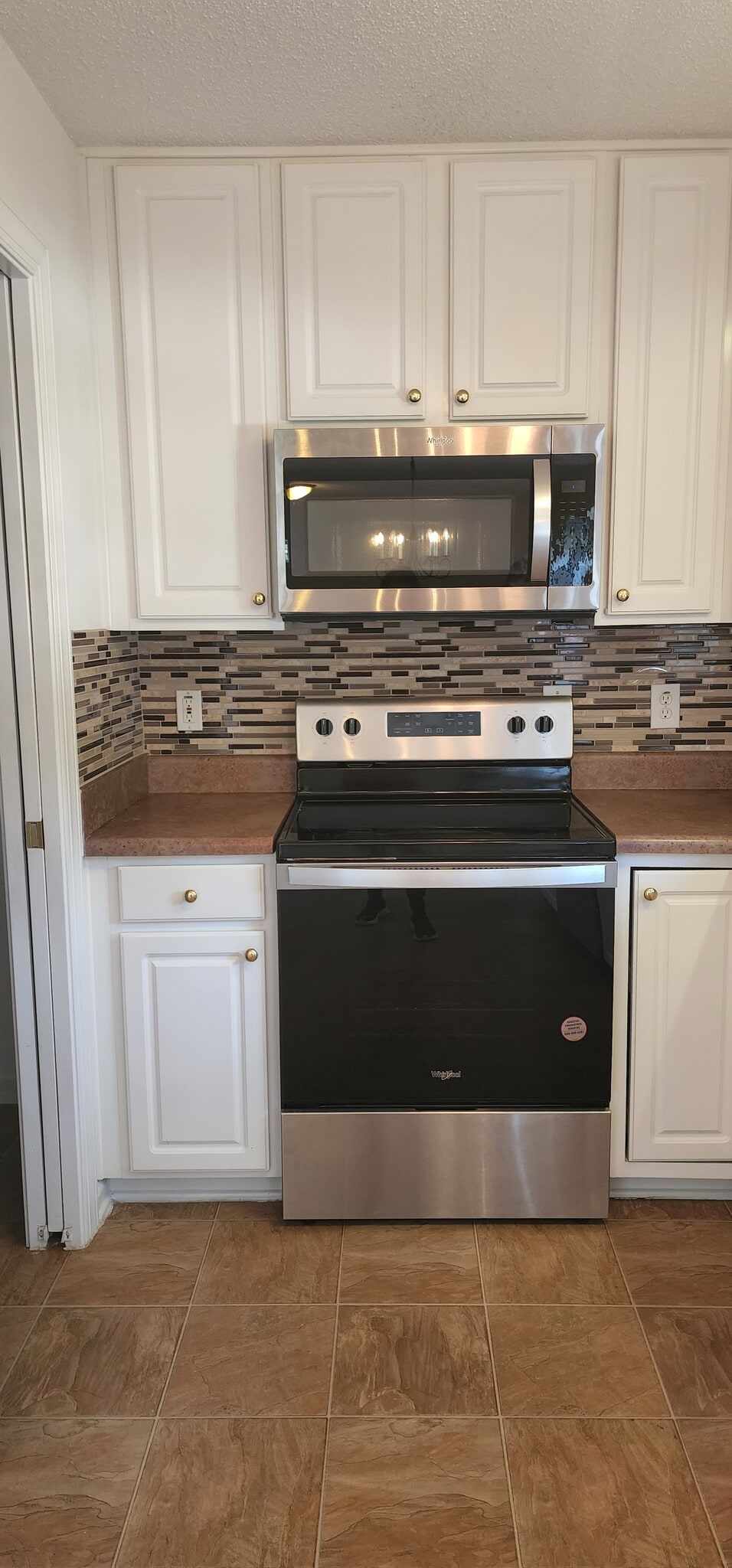 Whirlpool microwave and electric range. - 837 Shackleton Rd