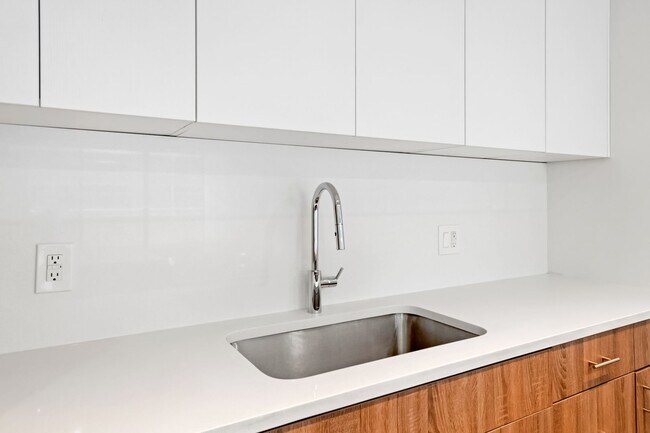 Building Photo - 2BR Condo w/ Covered Parking and Balcony Views at Broadway Towers