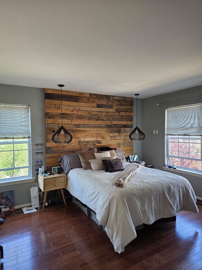 Building Photo - Stunning 3–4 Bedroom Townhome in Private Community | Garage + EV Charger | Deck with Tree Views