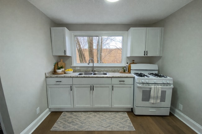 Building Photo - More Space Than You’d Expect: Updated 3BR w/ 1.5 Baths + Carpeted Attic Bonus