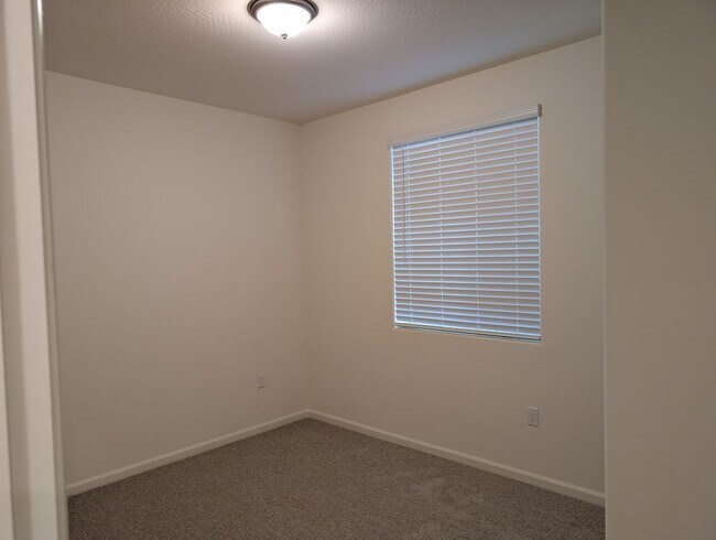 Building Photo - New Wilson home offering modern amenities, solar and a nice floor plan. Bonus room with den or of...