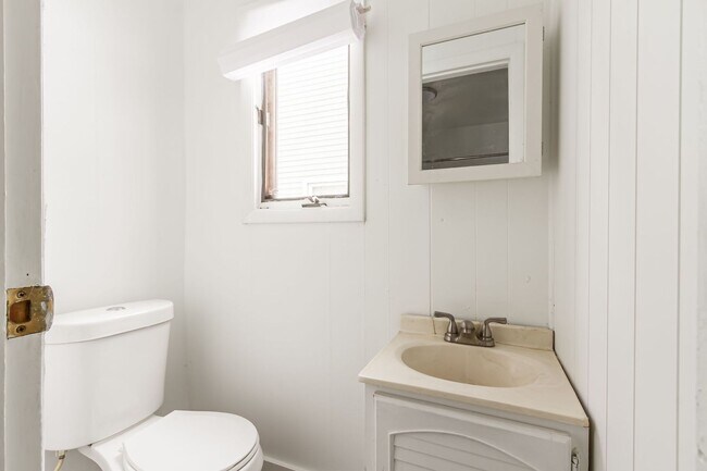 Building Photo - Spacious Rochester 3-Bedroom Home with Enclosed Porch + Backyard