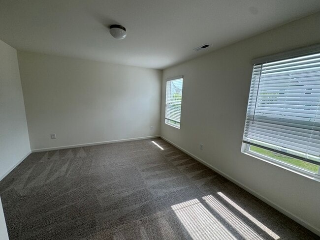 Building Photo - Corner townhome with three bedrooms 2 1/2 ...