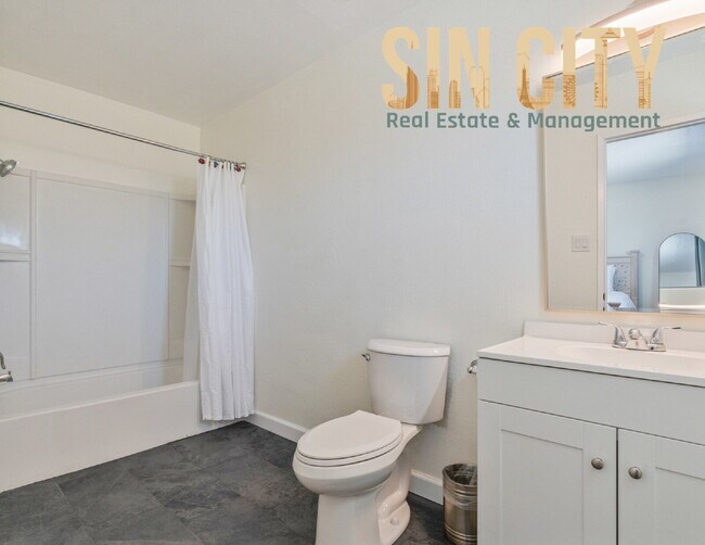 Building Photo - "Charming 4-Bedroom Retreat in Las Vegas –...