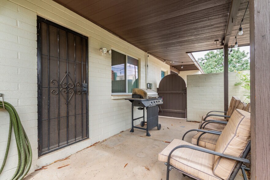 Back yard covered patio security door and gate entrance - 115 W 10th St
