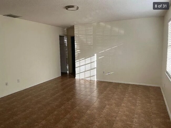 Building Photo - 2/2/1 home with a spacious fenced backyard...