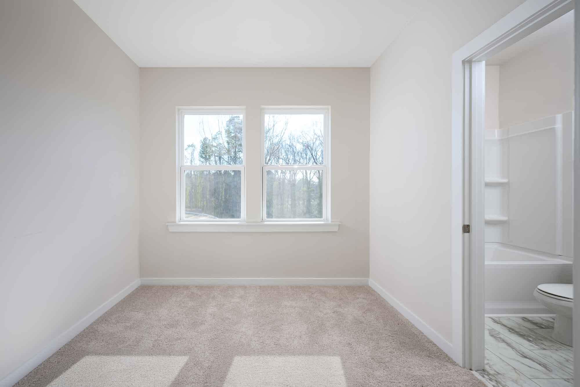 Generously sized secondary bedroom with a private en-suite bath. - 1421 Lithium Ln