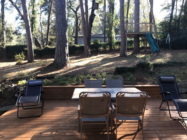 rear of home with deck table - 1803 Salmon Dr