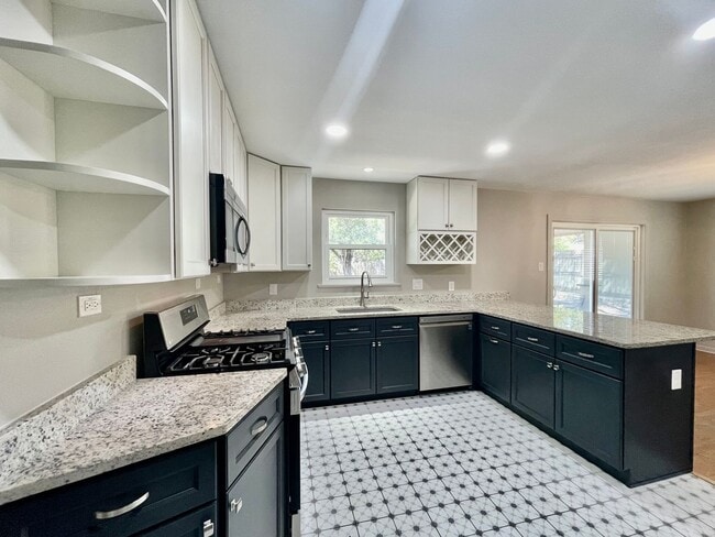 Building Photo - Updated Home w/ 2 Car Garage, Backyard and...